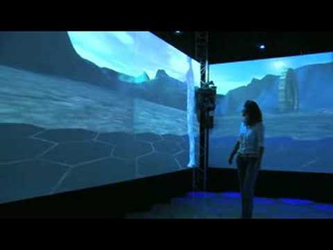 A visitor inside the XIM mixed-reality room, surrounded by projections